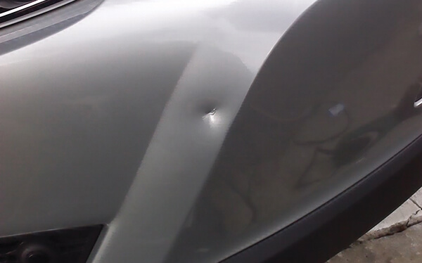 Damaged Car Dent Before Protection Treatment