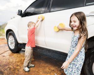 Children Playing While Washing Car